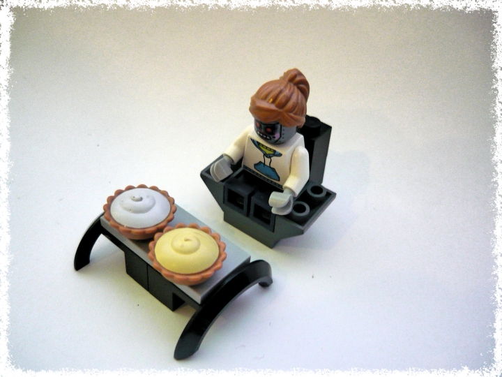 LEGO MOC - New Year's Brick 3015 - Долгожданный Новый 3015 Год.: Девушка робот, сидящая на кресле, перед столом с угощениями.